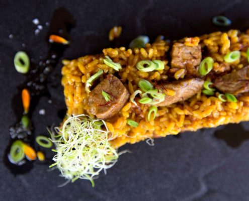 Arroz con magro de ibérico de Abrasador Restaurante Graná